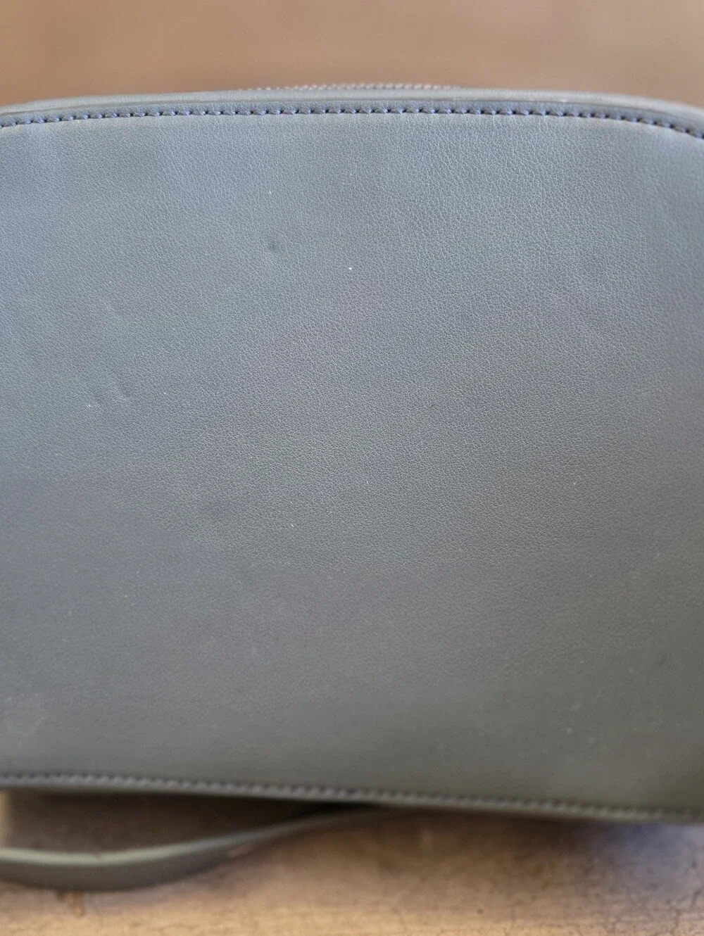 This is a TWELVElittle x The Sensible Mama Clutch in a muted blue vegan leather.